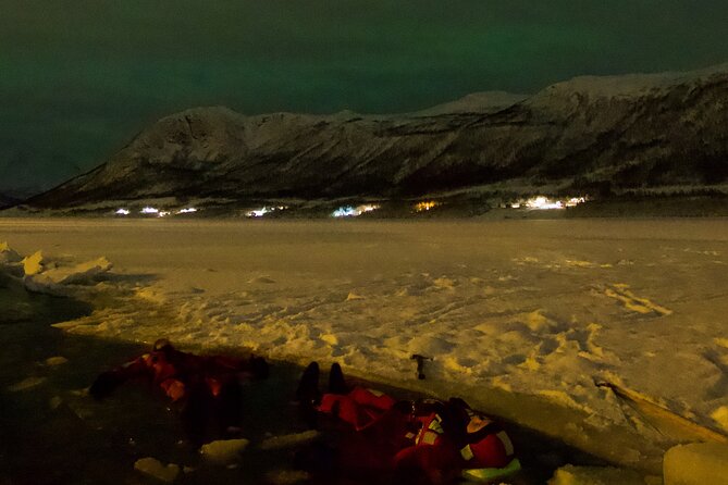Arctic Ocean Night Floating in Ramfjord - Watching the Northern Lights from the water