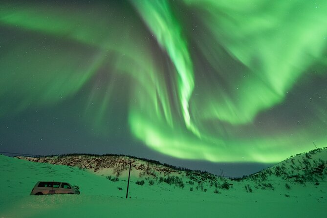 Aurora Hunt with the campfire and professional photographer - Thermal suits help, but pack your winter gear