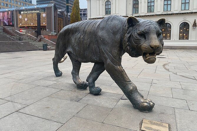 Central Oslo Guided Walking Tour with Local Guide - Starting with the Tiger at Jernbanetorget