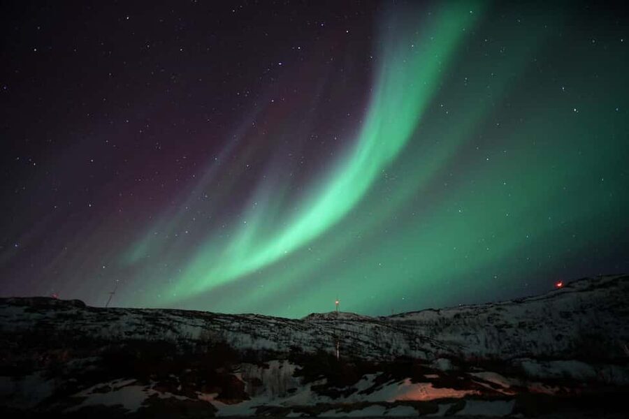 From Tromsø: Aurora Bus Tour with Snacks, Photos, and Drinks - Riding through the Arctic night