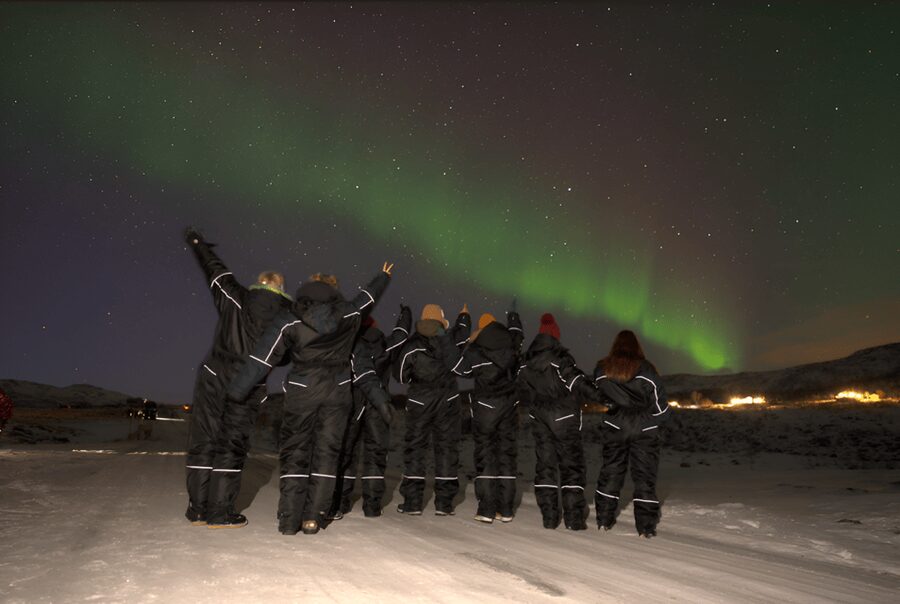From Tromsø: Northern Lights Tour in Minibus with Photos - Outdoor viewing with suits, spikes, and lamps