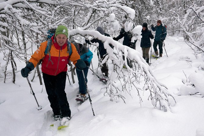 Guided Snowshoe Walk on Tromsoya Island in Tromso - Getting fitted with snowshoes near the city