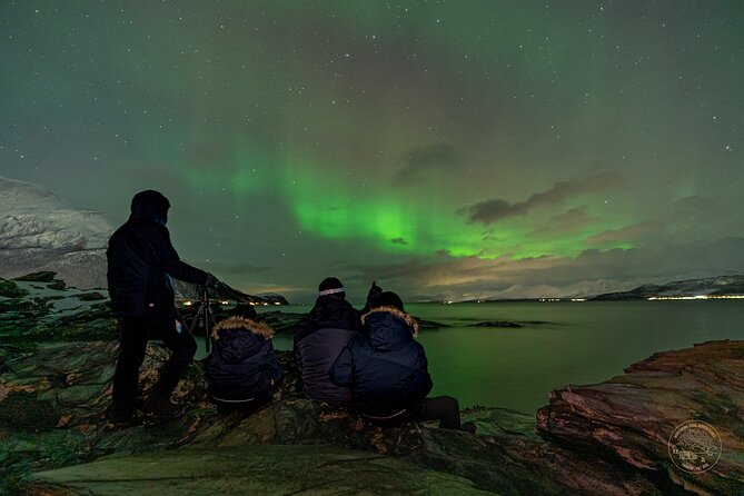 Small Group Van Journey in Search of the Northern Lights - Staying warm with Arctic gear and a campfire