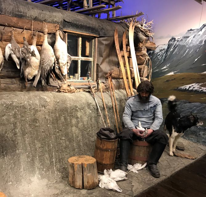 Tromsø: Arctic Exploration Historic Walking Tour - Walking Storgata toward Tromsø’s oldest pub