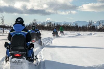 Scenic Arctic snowmobile safari in the Lyngen Alps